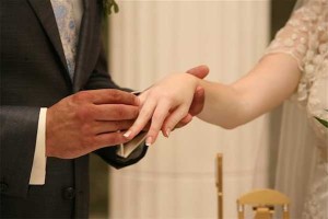 Stressors leading to divorce - photo of groom placing ring on bride's hand